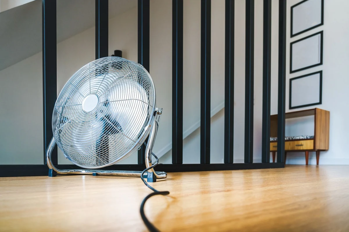 Floor fan running in a warm room